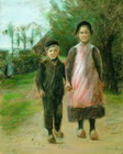 Nia y nio en una calle de pueblo